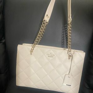 Kate spade bag, it is medium size, has many components and space